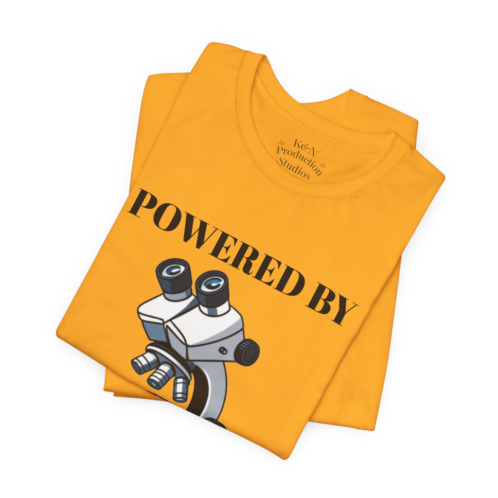 “Powered by Caffeine & Chaos” Funny Lab Tech T-Shirt – Cartoon Microscope & Coffee Cup